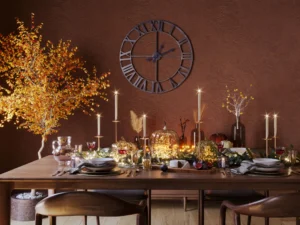 Festive dining table with candles and decorations.