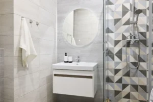 Modern bathroom with geometric shower tiles.
