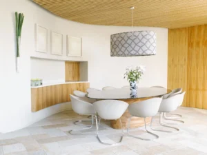 Modern dining room with circular table setting.