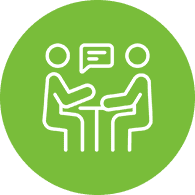 Two figures talking at a table icon.