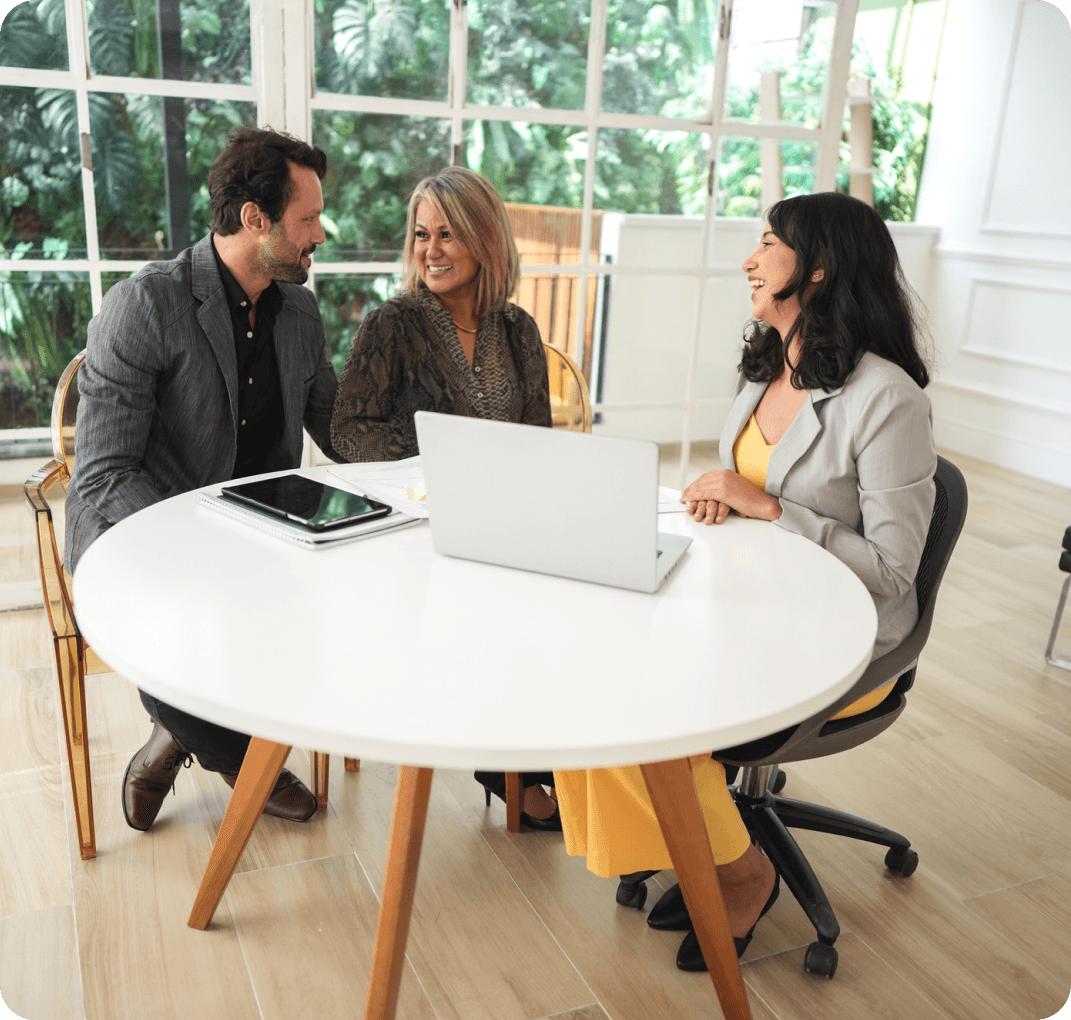 Three people having a business meeting.