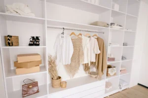 Minimalist wardrobe with clothes and accessories.