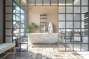 Modern bathroom with marble bathtub and plants.