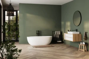 Modern bathroom with green walls and bathtub.