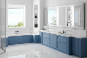 Modern bathroom with blue cabinets and mirrors.